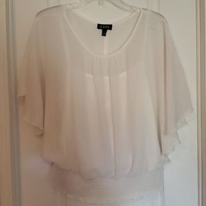 White sheer blouse with built in underlay.